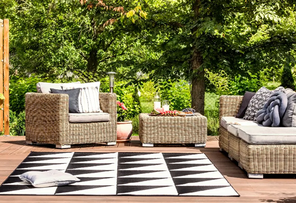 A black and white rug on a wooden deck in Atlanta, GA