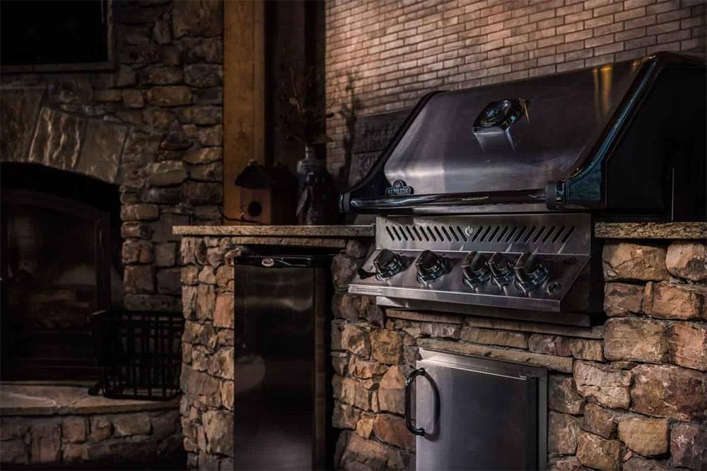 Modern outdoor living space with a wood deck and seating in a North Atlanta backyard.