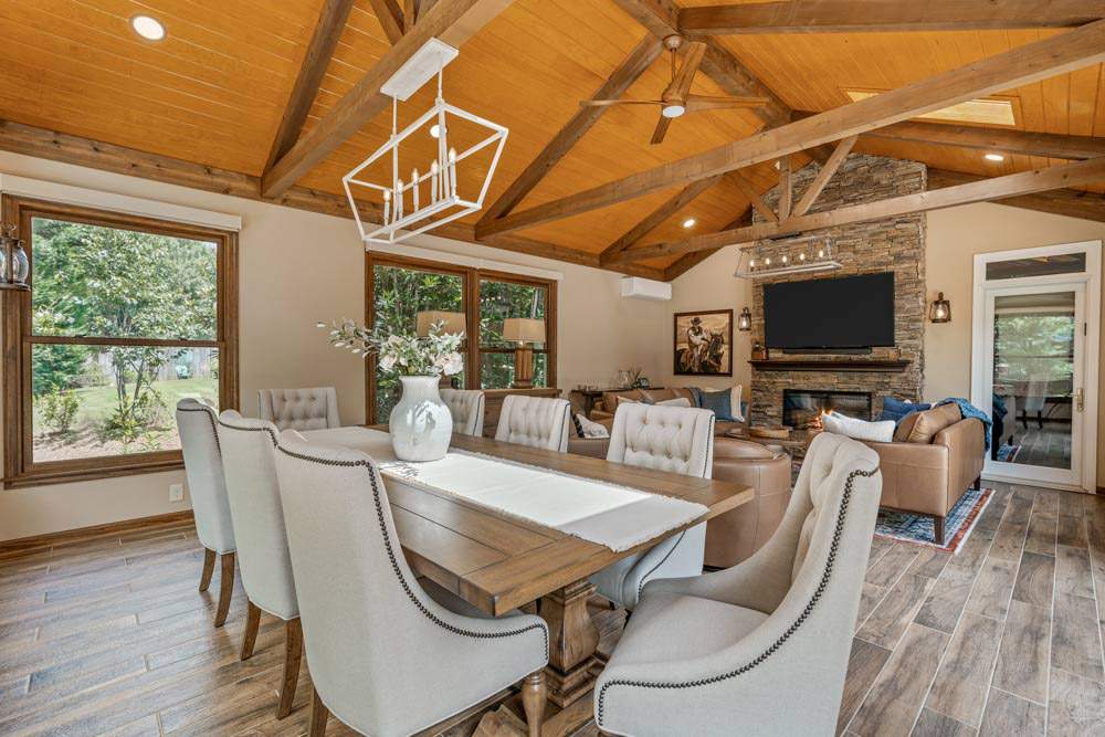 Sunroom with Teal Walls and a Cozy Seating Area Filled with Natural Light in North Atlanta