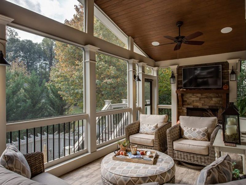 Screened Back Porch with a Mounted TV and Comfortable Lounge Seating in North Atlanta