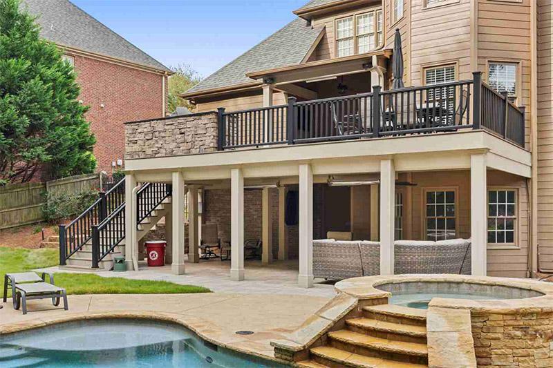 Two-Story Deck with Covered Upper Level, Poolside Patio, and Stair Access in North Atlanta