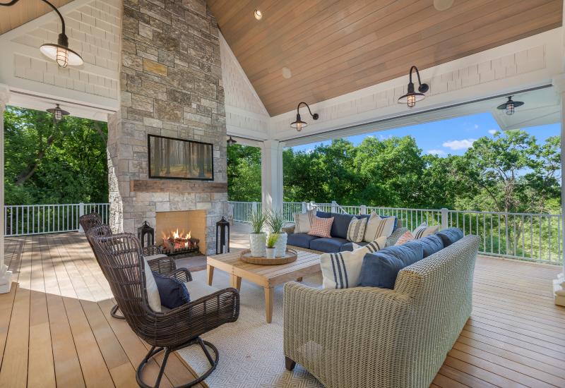 Custom outdoor fireplace constructed by Exterior Design + Decks in North Atlanta